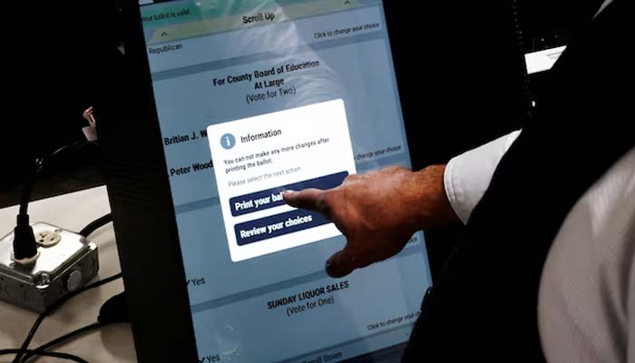 Bartow County Elections Supervisor Joseph Kirk demonstrates a voting machine as new strategies are being adopted to prepare for political interference, misinformation, cyberattacks, and physical threats ahead of the 2026 midterms, in Cartersville, Georgia, US, September 2, 2026. — Reuters