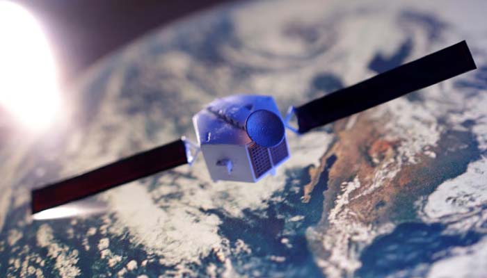 A satellite model is placed on a picture of Earth in this illustration taken November 25, 2024. — Reuters