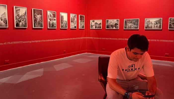 Opposition leader Rahul Gandhi’s nephew, Raihan Vadra, sits in a hall surrounded by paintings. — X/@priyankagandhi