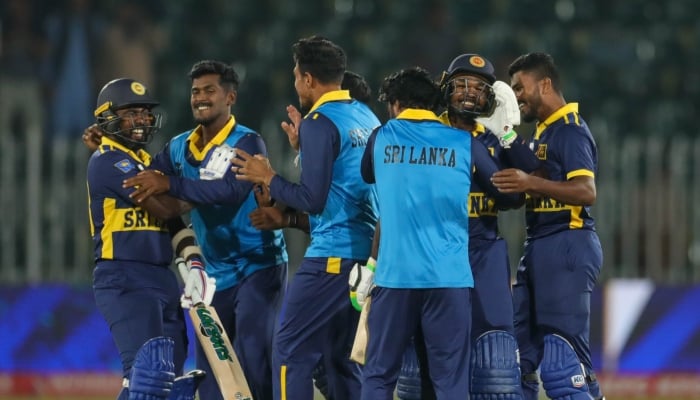 Sri Lankan players celebrate after winning the third one-day international of the tri-series match against England at the Rawalpindi Cricket Stadium in Rawalpindi on October 22, 2026. — PCB