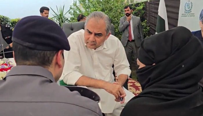 Federal Interior Minister Mohsin Naqvi listens to citizens complaints during an open court at NCCIA Zonal Headquarters in Lahore on October 23, 2026. — X/ @MOIofficialGoP