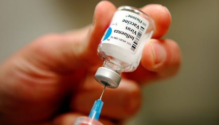 A nurse prepares an injection of the influenza vaccine at Massachusetts General Hospital in Boston, Massachusetts January 10, 2013. — Reuters