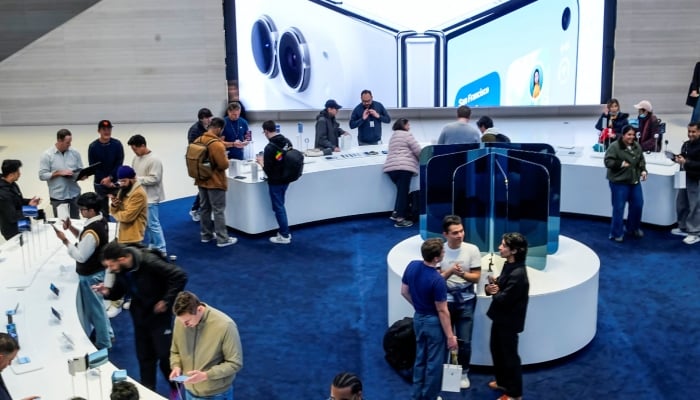Customers take a look at Apples new foldable iPhone Duo phone on the launch day at the Apple Fifth Avenue flagship store in New York City, US, October 23, 2026. — Reuters