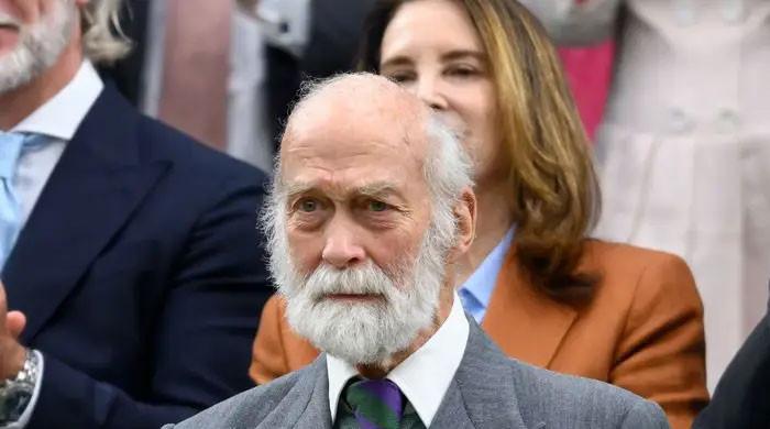 Prince Michael of Kent enjoys vintage car tour during rare public appearance