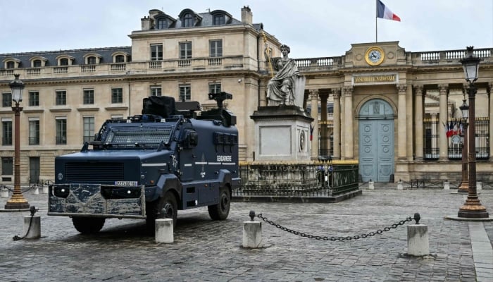 This photograph shows a multipurpose intervention vehicle (VIPG) Centaure of the French gendarmerie with the National Assembly building in the background in Paris on October 24, 2026. — AFP