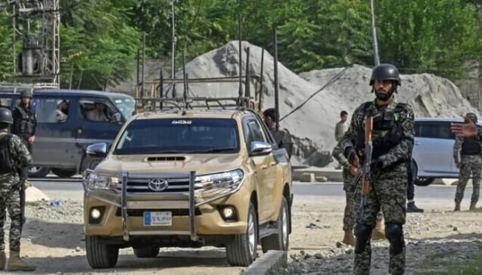 Security personnel stand guard in Bajaur district of Khyber Pakhtunkhwa. — AFP/File