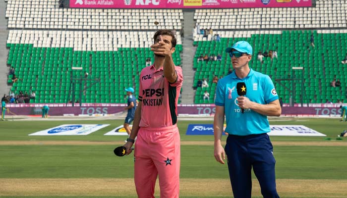 Pakistan captain Shaheen Afridi (left) flips the coin as England captain Harry Brook (centre) calls during the toss ahead of the fourth match of the ODI tri-nation series at the Gaddafi Stadium in Lahore on October 25, 2026. — PCB