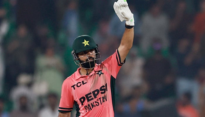 Pakistans Shadab Khan celebrates after reaching his century against England at the Gaddafi Stadium in Lahore, on October 25, 2026. — Reuters