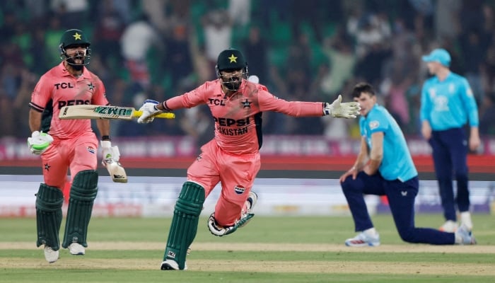 Pakistans Haris Rauf and Pakistans Shadab Khan celebrate after winning the fourth match of the ODI tri-series against England at Gaddafi Stadium in Lahore on October 25, 2026. — Reuters