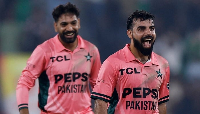 Pakistans Haris Rauf (left) and Shadab Khan celebrate after winning the fourth ODI tri-series match against England at Gaddafi Stadium in Lahore, Pakistan, on October 25, 2026. — Reuters