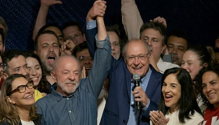 Brazils President and re-election candidate for the Workers Party (PT), Luiz Inácio Lula da Silva, reacts next to his wife, First Lady Rosângela da Silva (2nd L) and Vice President Geraldo Alckmin (3rd R) after knowing the first results of the presidential runoff election, in São Paulo, Brazil, on October 25, 2026. — AFP