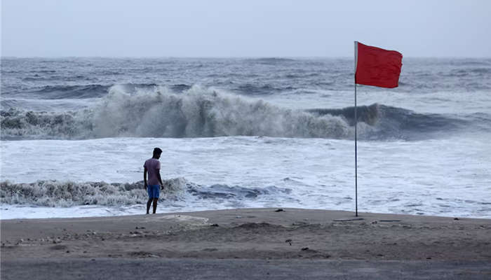 A lifeguard patrols Juhu beach, during a red flag alert due to rough seas caused by cyclone in India. — Reuters/File