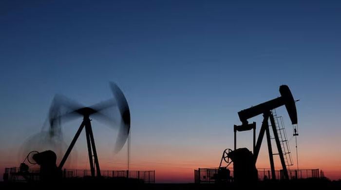 Oil slips $2 a barrel but stays near six-month highs on Saudi attacks