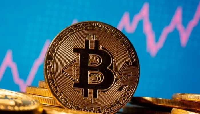 A representation of virtual currency Bitcoin is seen in front of a stock graph in this illustration taken November 19, 2020. — Reuters