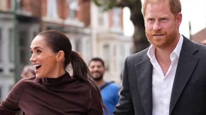 Meghan Markle flees sharks for real ones with Harry and kids