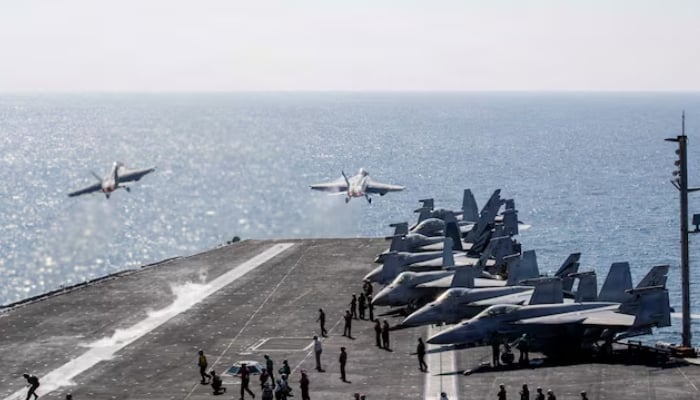 Two F/A-18 Super Hornets launch from the flight deck of the US Navy Nimitz-class aircraft carrier USS Abraham Lincoln in support of the Operation Epic Fury attack on Iran from an undisclosed location on March 3, 2026. — Reuters