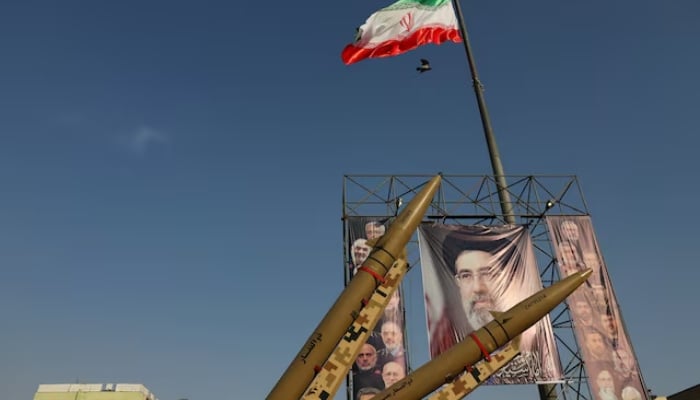 Iranian missiles are displayed next to a banner with a picture of Irans Supreme Leader, Mojtaba Khamenei, on a street in Tehran, Iran, September 27, 2026. — Reuters