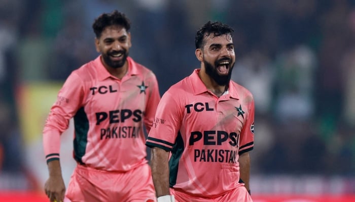 Pakistans Haris Rauf (left) and Shadab Khan celebrate after their victory over England in the fourth match of the ODI tri-series against England at the Gaddafi Stadium, Lahore, October 25, 2026. — Reuters