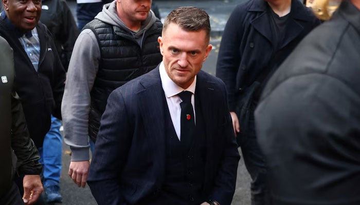 Activist Stephen Yaxley-Lennon, known as Tommy Robinson, arrives at Southwark Crown Court as he appears on trial on two charges of harassment causing fear of violence, in London, Britain, October 27, 2026. — Reuters