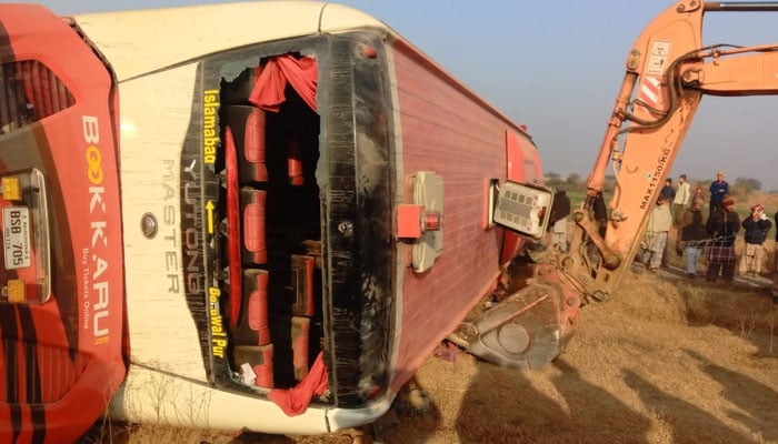Rescue efforts are underway at the accident site near Fateh Jang where a bus overturned on December 30, 2024. — Screengrab via Geo News